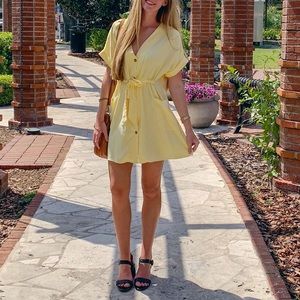 Yellow Zara dress, cinched at waist.